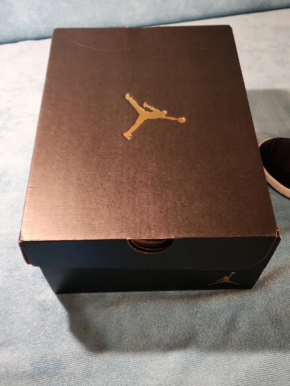 Jordan Black and Metallic Gold Mid-Top Sneakers